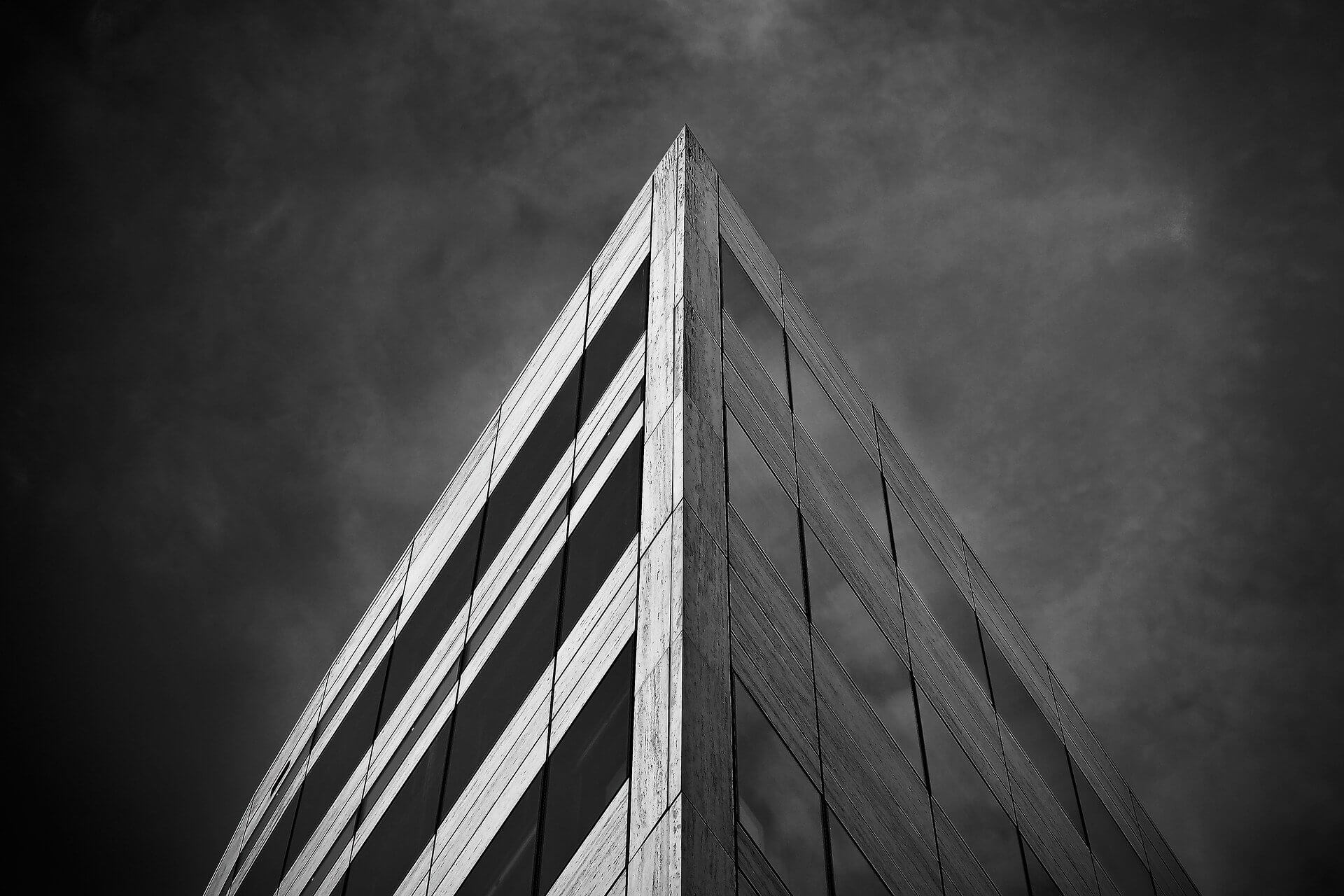 The corner of a black and white building designed by a CAD agency
